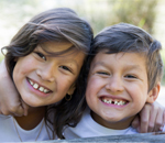 girl and boy smiling