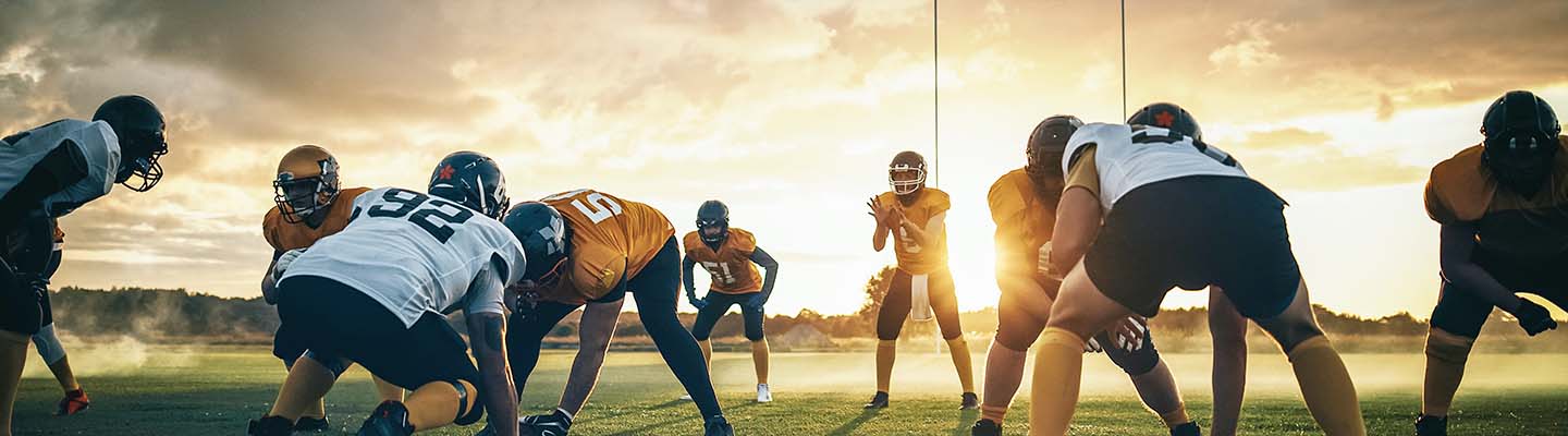 Football players at sunset