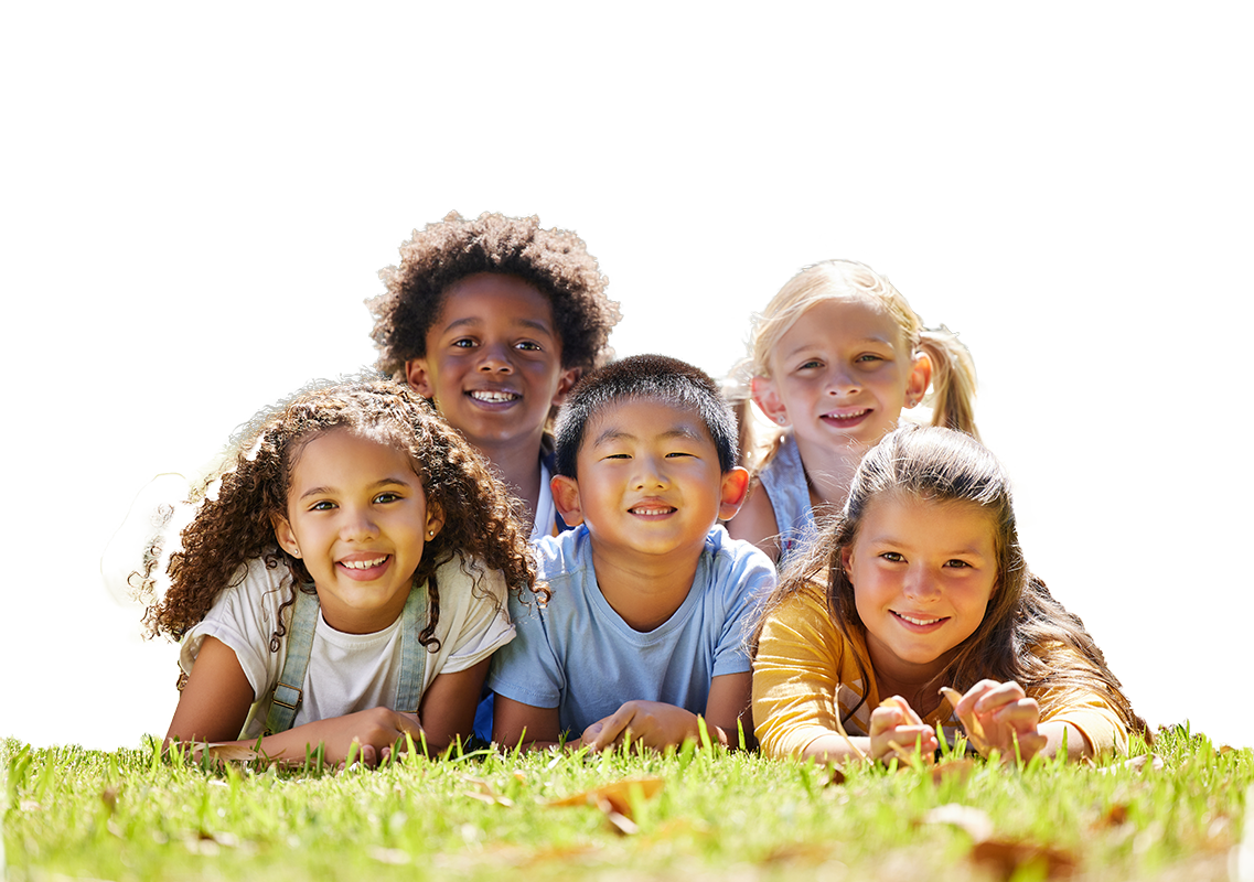 Children running in a grassy field.